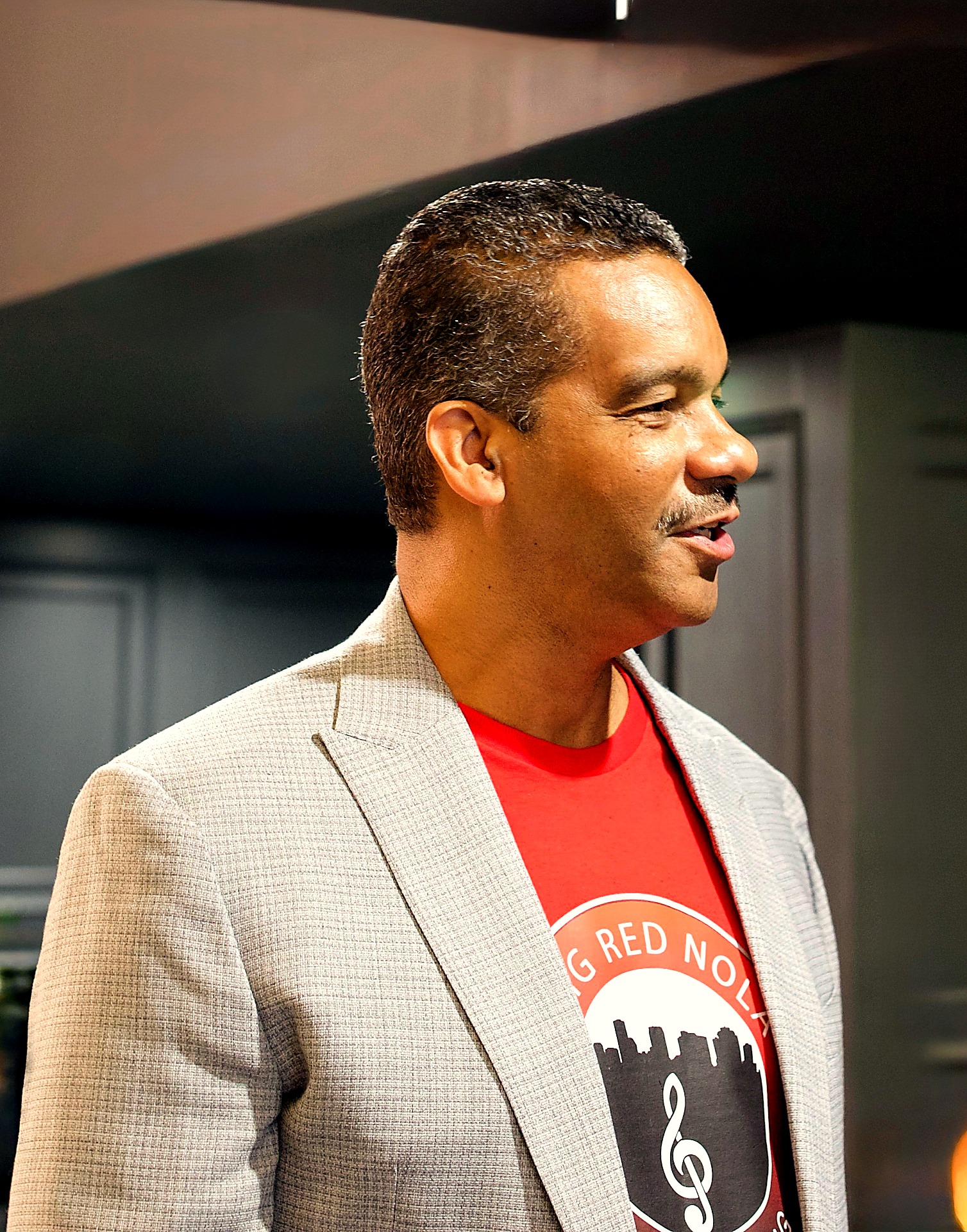 Portrait of Cyril Darensbourg, CEO and founder of Big Red NOLA Publishing, wearing a Big Red NOLA tee