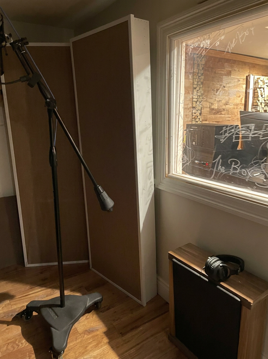Cleaned booth wall and microphone area prepared for featured artwork