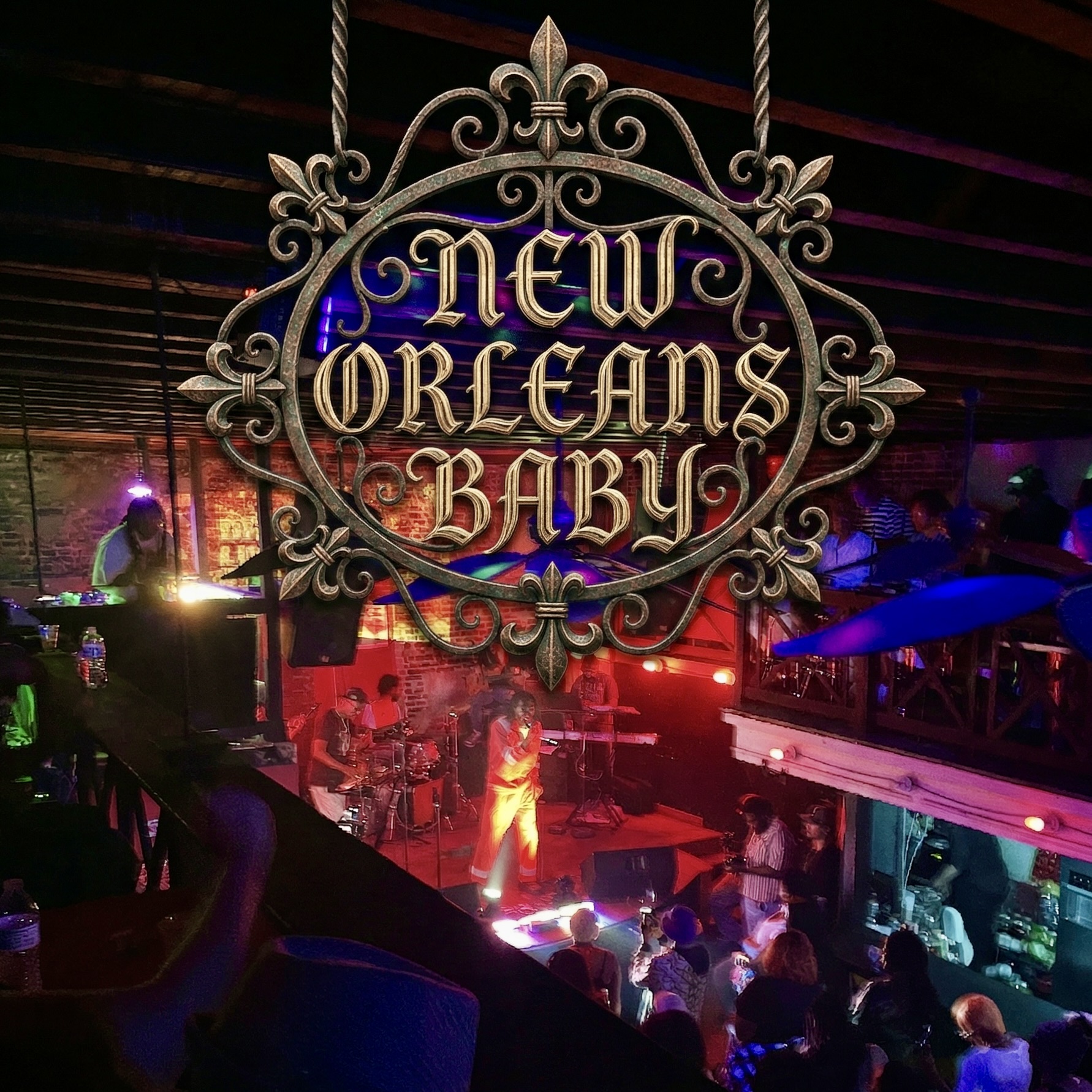 New Orleans Baby venue sign hanging above the stage