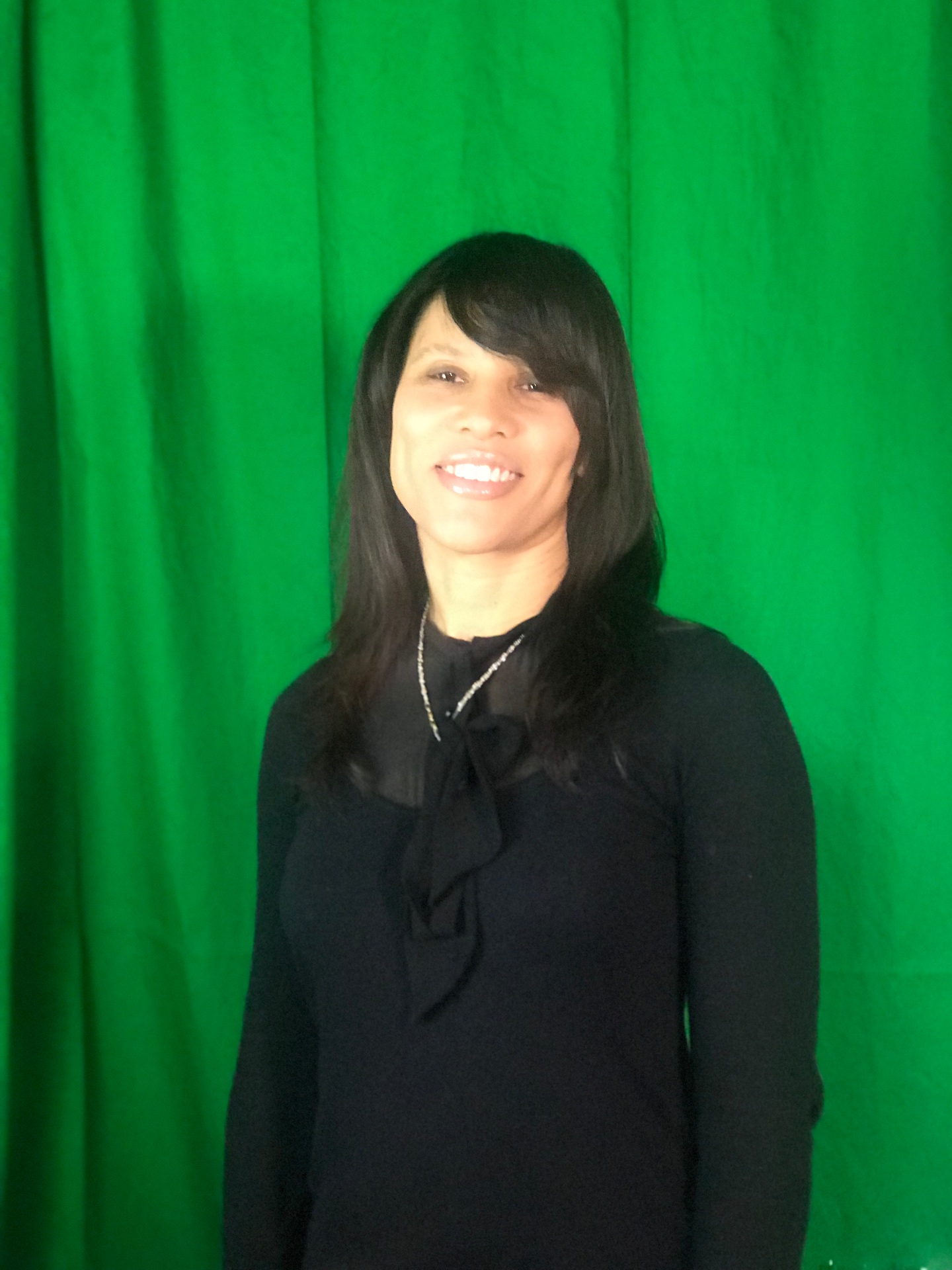 Studio portrait — green room, before the call to order.
