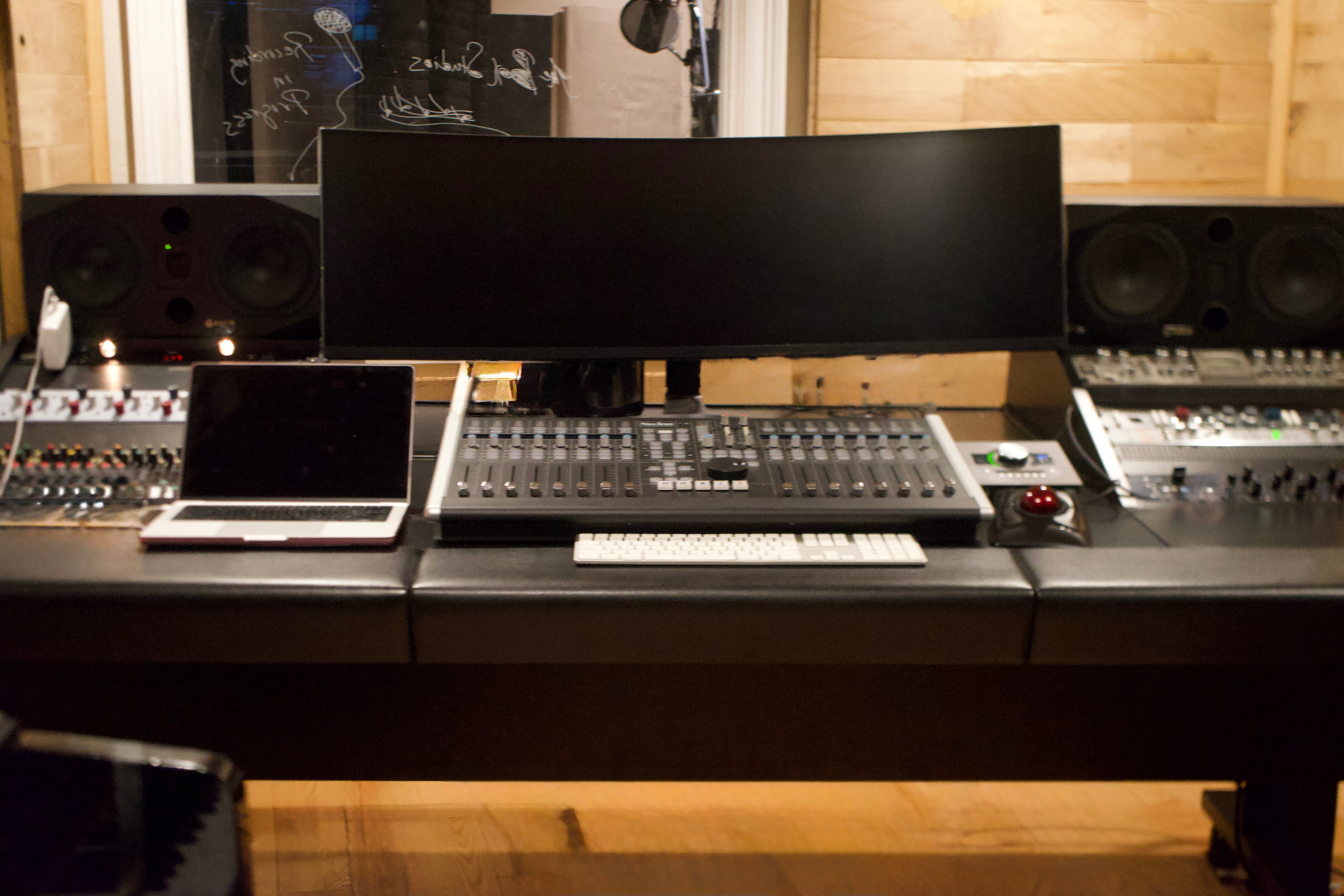 Two monitors, faders down, the room held quiet before record.